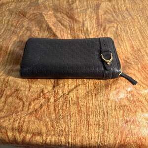 Gucci Microguccissima Black Leather Zip Around Wallet with Gold Buckle Detail
